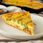 crossection of asparagus quiche with gruyere and bacon